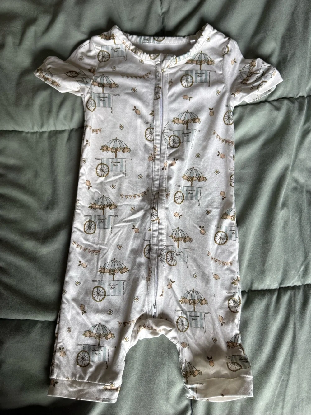 White Kids Zip-Front Pajama Romper with Carousel Cart Print